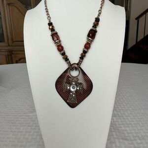 Brown Cross and Striated Resin Gold Tone Pendant Necklace